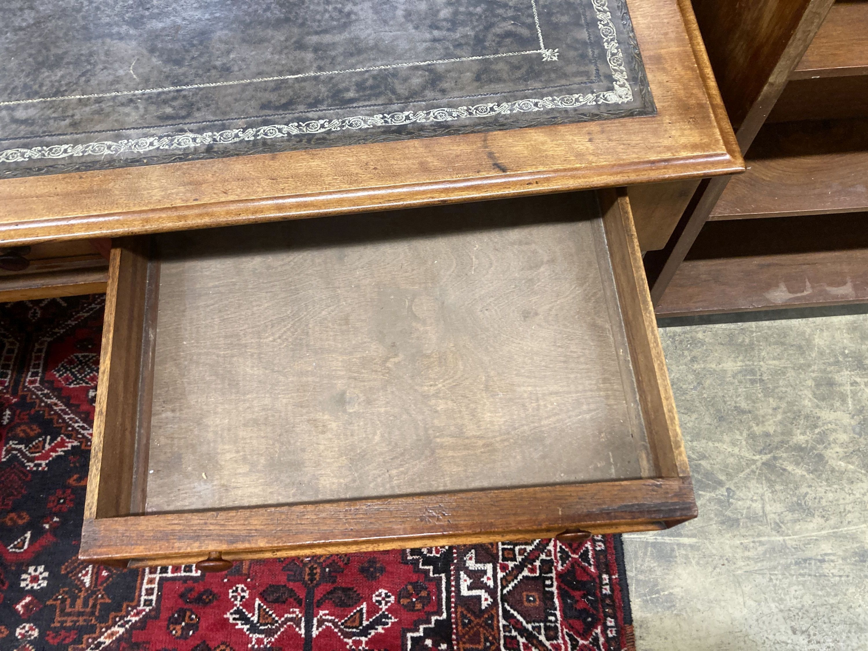 A Victorian mahogany two drawer writing table, with a leather inset top, width 114cm, depth 52cm, height 80cm